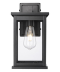 11"H Bowton II Outdoor Wall Light - Dusk to Dawn Matte Black Finish with Glass Shade by Millennium Lighting